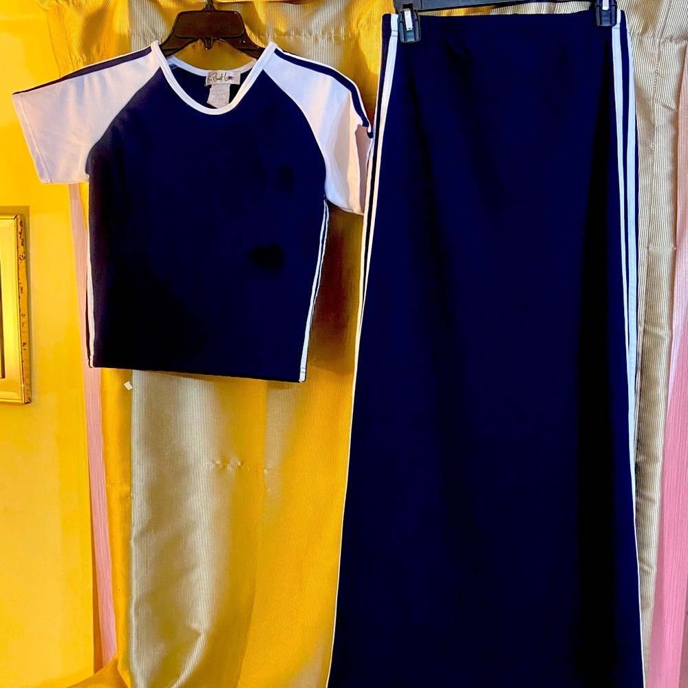Top Size Medium. Skirt Size Small. Polyester. Spandex Fit.